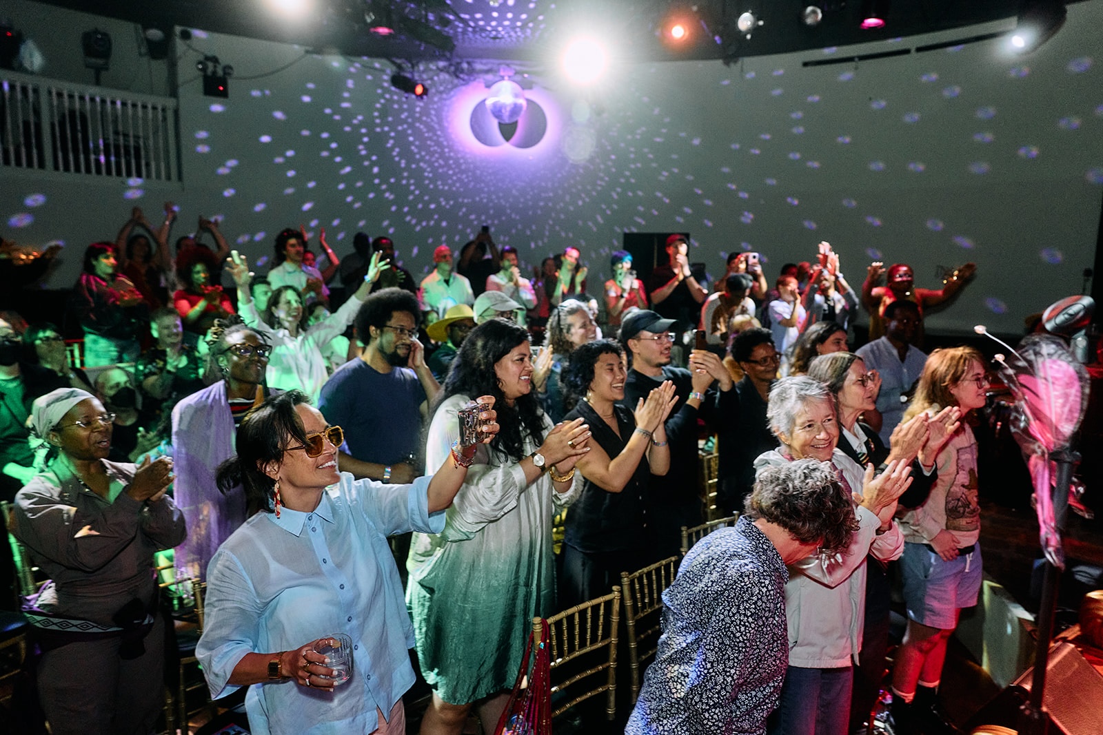 Queer community members gathered at a QCC event.